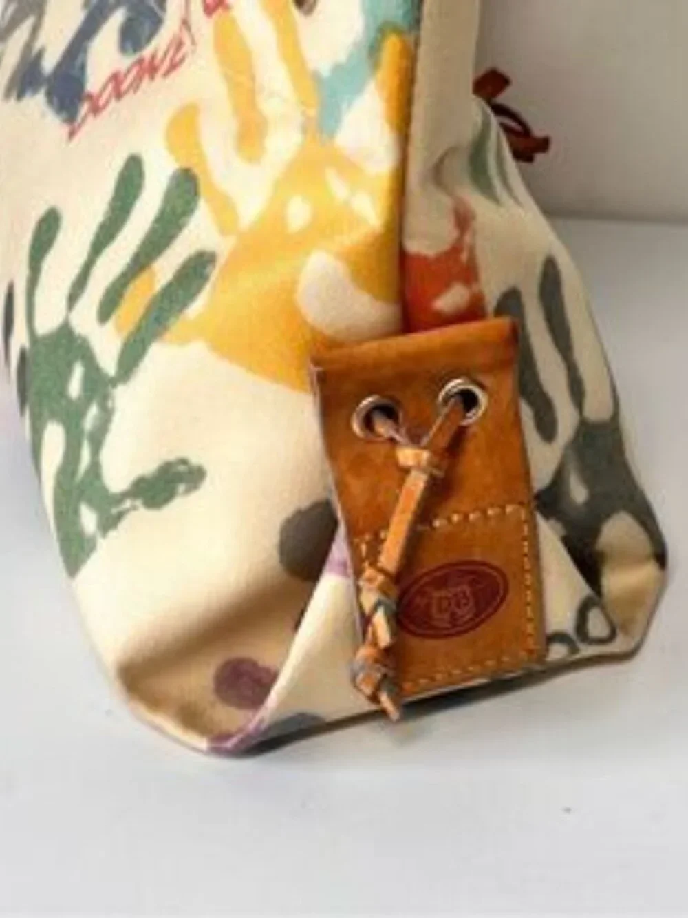 DOONEY & BOURKE Authentic Vintage Y2K Leather Baby Hands Print Tassel Bag